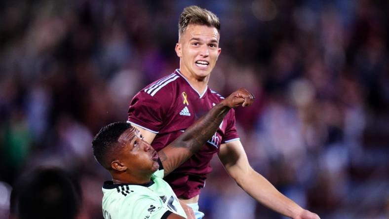 Sep 30, 2023; Commerce City, Colorado, USA; Austin FC midfielder Jhojan Valencia (5) and Colorado Rapids midfielder Cole Bassett (23) during the second half at Dick's Sporting Goods Park. Mandatory Credit: Ron Chenoy-USA TODAY Sports