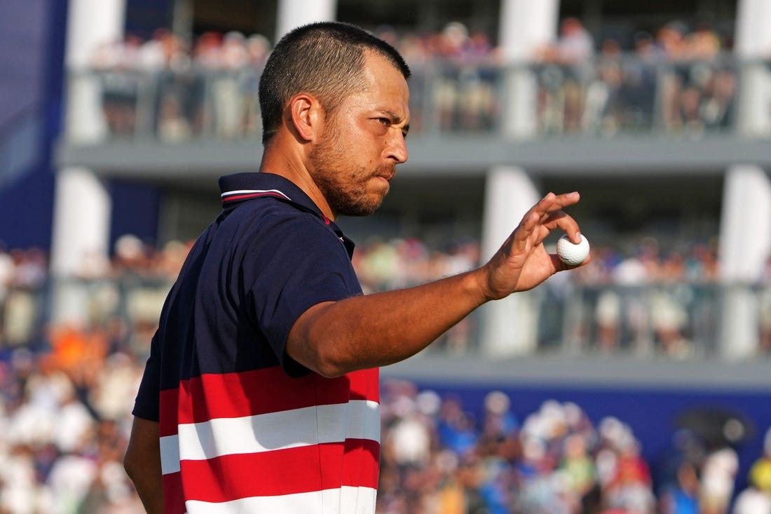 Oct 1, 2023; Rome, ITA; Team USA golfer Xander Schauffele waves after winning on the 16th hole during the final day of the 44th Ryder Cup golf competition at Marco Simone Golf and Country Club. Mandatory Credit: Kyle Terada-USA TODAY Sports