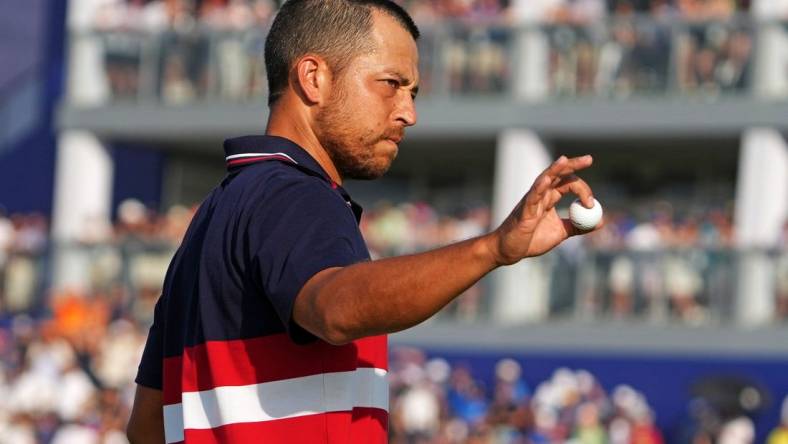 Oct 1, 2023; Rome, ITA; Team USA golfer Xander Schauffele waves after winning on the 16th hole during the final day of the 44th Ryder Cup golf competition at Marco Simone Golf and Country Club. Mandatory Credit: Kyle Terada-USA TODAY Sports