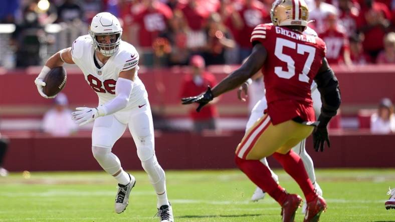 Tight end Zach Ertz (86) runs with the ball after making a catch next to San Francisco 49ers linebacker Dre Greenlaw (57) in the second quarter at Levi's Stadium. Mandatory Credit: Cary Edmondson-USA TODAY Sports