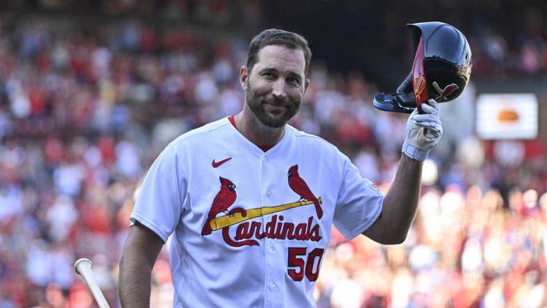 Oct 1, 2023; St. Louis, Missouri, USA;  St. Louis Cardinals pinch hitter Adam Wainwright (50) tips his cap as he receives a standing ovation after his final at bat during the eighth inning against the Cincinnati Reds at Busch Stadium. Mandatory Credit: Jeff Curry-USA TODAY Sports