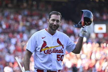 Oct 1, 2023; St. Louis, Missouri, USA;  St. Louis Cardinals pinch hitter Adam Wainwright (50) tips his cap as he receives a standing ovation after his final at bat during the eighth inning against the Cincinnati Reds at Busch Stadium. Mandatory Credit: Jeff Curry-USA TODAY Sports