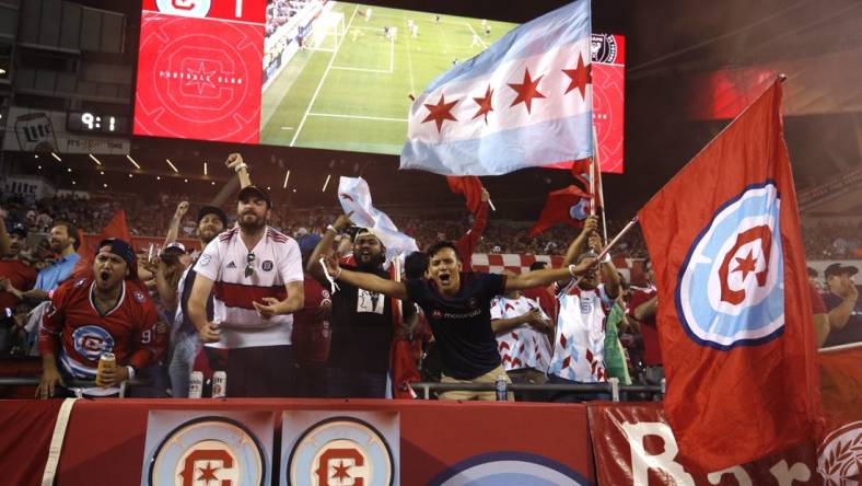 Oct 4, 2023; Chicago, Illinois, USA; Chicago Fire fans celebrate in the stands during the second half against the Inter Miami CF at Soldier Field. Mandatory Credit: Jon Durr-USA TODAY Sports