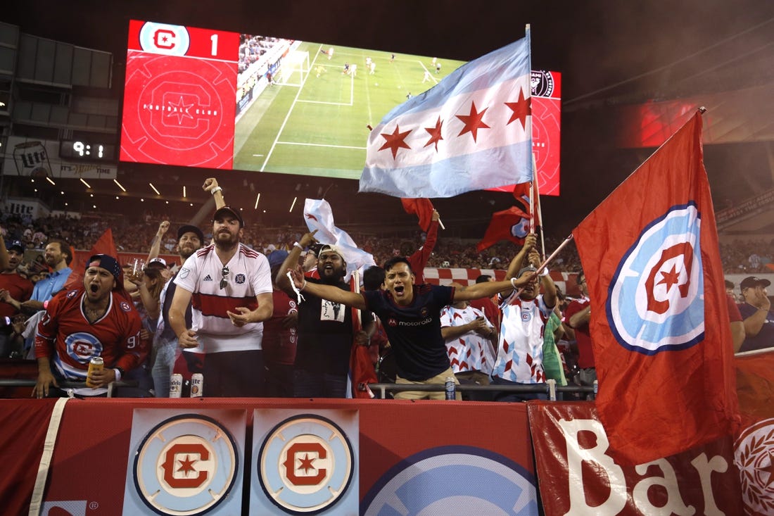 Oct 4, 2023; Chicago, Illinois, USA; Chicago Fire fans celebrate in the stands during the second half against the Inter Miami CF at Soldier Field. Mandatory Credit: Jon Durr-USA TODAY Sports