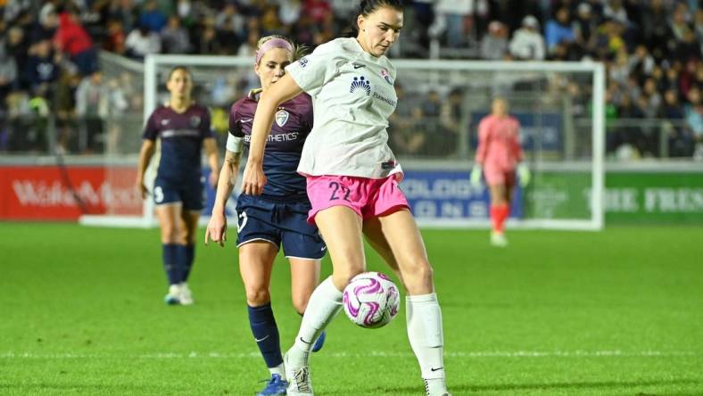 Oct 7, 2023; Cary, North Carolina, USA; San Diego Wave FC midfielder Taylor Kornieck (22) controls the ball against North Carolina Courage midfielder Denise O'Sullivan (10) during the second half at WakeMed Soccer Park. Mandatory Credit: Rob Kinnan-USA TODAY Sports