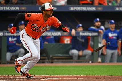 Oct 8, 2023; Baltimore, Maryland, USA; Baltimore Orioles center fielder Aaron Hicks (34) hits a two run RBI during the first inning against the Texas Rangers during game two of the ALDS for the 2023 MLB playoffs at Oriole Park at Camden Yards. Mandatory Credit: Tommy Gilligan-USA TODAY Sports
