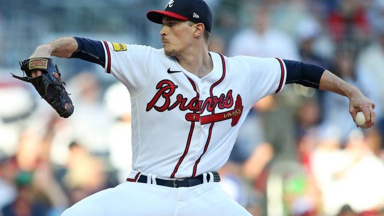 Oct 9, 2023; Cumberland, Georgia, USA; Atlanta Braves starting pitcher Max Fried (54) pitches during the first inning against the Philadelphia Phillies in game two of the NLDS for the 2023 MLB playoffs at Truist Park. Mandatory Credit: Brett Davis-USA TODAY Sports