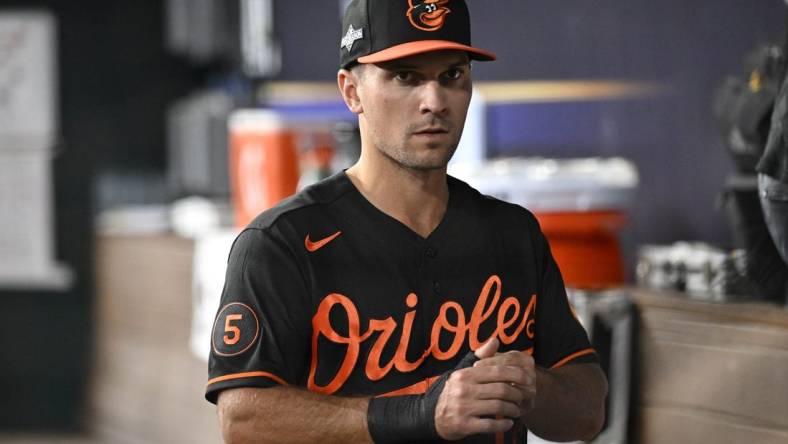 Oct 10, 2023; Arlington, Texas, USA; Baltimore Orioles second baseman Adam Frazier (12) in the dugout during warm ups before game three against the Texas Rangers in the ALDS for the 2023 MLB playoffs at Globe Life Field. Mandatory Credit: Jerome Miron-USA TODAY Sports