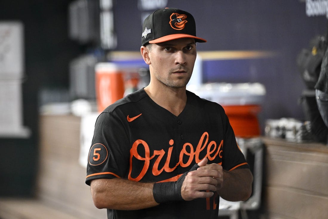 Oct 10, 2023; Arlington, Texas, USA; Baltimore Orioles second baseman Adam Frazier (12) in the dugout during warm ups before game three against the Texas Rangers in the ALDS for the 2023 MLB playoffs at Globe Life Field. Mandatory Credit: Jerome Miron-USA TODAY Sports