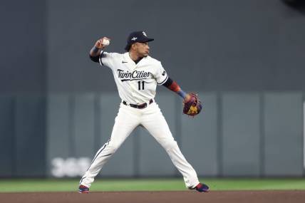 Oct 11, 2023; Minneapolis, Minnesota, USA; Minnesota Twins second baseman Jorge Polanco (11) throws to first for an out in the eighth inning against the Houston Astros during game four of the ALDS for the 2023 MLB playoffs at Target Field. Mandatory Credit: Jesse Johnson-USA TODAY Sports