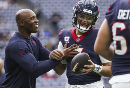 Oct 15, 2023; Houston, Texas, USA; Houston Texans head coach DeMeco Ryans laughs with quarterback C.J. Stroud (7) before the game against the New Orleans Saints at NRG Stadium. Mandatory Credit: Troy Taormina-USA TODAY Sports