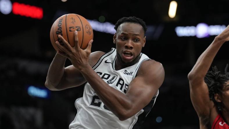 Oct 18, 2023; San Antonio, Texas, USA; San Antonio Spurs center Charles Bassey (28) rebounds in the second half against the Houston Rockets at the Frost Bank Center. Mandatory Credit: Daniel Dunn-USA TODAY Sports