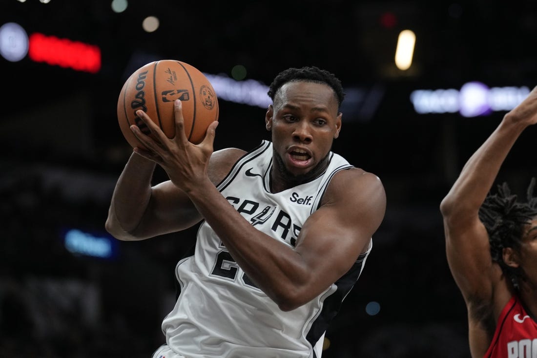 Oct 18, 2023; San Antonio, Texas, USA; San Antonio Spurs center Charles Bassey (28) rebounds in the second half against the Houston Rockets at the Frost Bank Center. Mandatory Credit: Daniel Dunn-USA TODAY Sports
