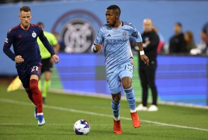Oct 21, 2023; New York, NY, New York, NY, USA; New York City FC midfielder Andres Perea (15) dribbles against Chicago Fire midfielder Fabian Herbers (21) during the second half at Citi Field. Mandatory Credit: Vincent Carchietta-USA TODAY Sports