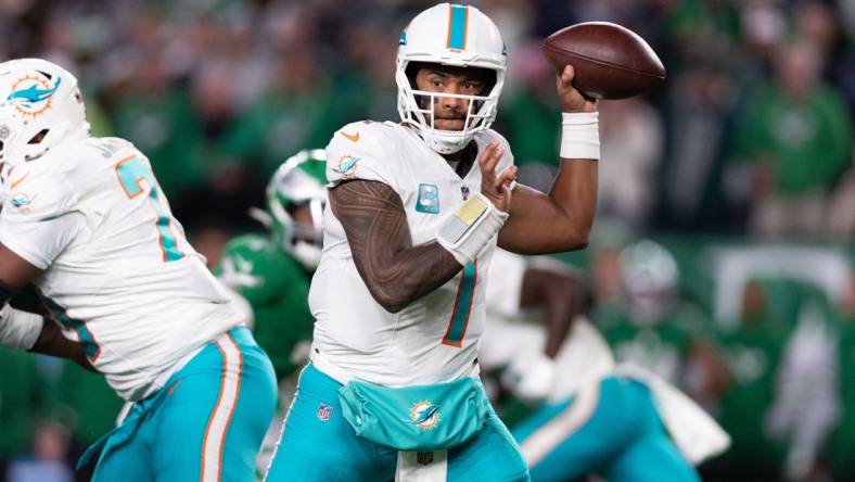 Oct 22, 2023; Philadelphia, Pennsylvania, USA; Miami Dolphins quarterback Tua Tagovailoa (1) passes the ball against the Philadelphia Eagles during the second quarter at Lincoln Financial Field. Mandatory Credit: Bill Streicher-USA TODAY Sports