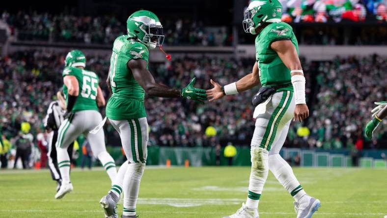 Oct 22, 2023; Philadelphia, Pennsylvania, USA; Philadelphia Eagles quarterback Jalen Hurts (1) and wide receiver A.J. Brown (11) shake hands after a touchdown drive against the Miami Dolphins during the fourth quarter at Lincoln Financial Field. Mandatory Credit: Bill Streicher-USA TODAY Sports