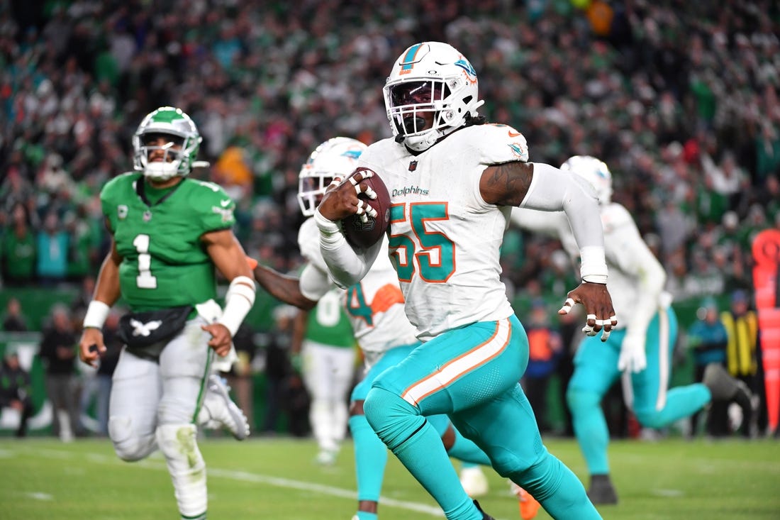 Oct 22, 2023; Philadelphia, Pennsylvania, USA; Miami Dolphins linebacker Jerome Baker (55) returns an interception for a touchdown  during the third quarter against the Philadelphia Eagles at Lincoln Financial Field. Mandatory Credit: Eric Hartline-USA TODAY Sports