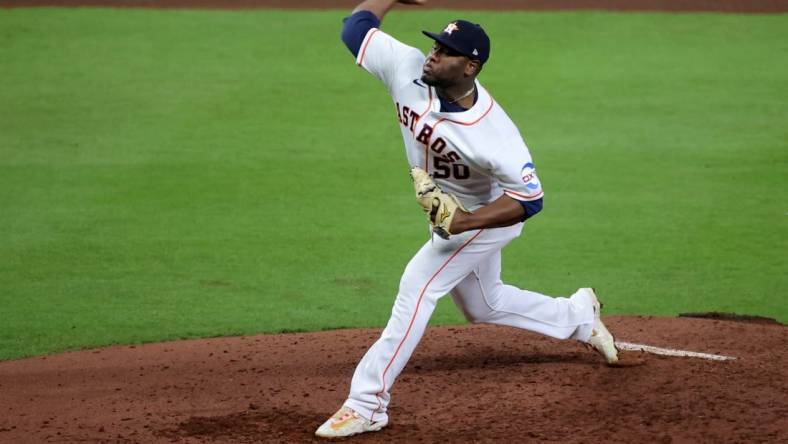 Oct 23, 2023; Houston, Texas, USA; Houston Astros pitcher Hector Neris (50) during the fourth inning of game seven in the ALCS against the Texas Rangers for the 2023 MLB playoffs at Minute Maid Park. Mandatory Credit: Erik Williams-USA TODAY Sports