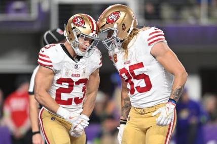 Oct 23, 2023; Minneapolis, Minnesota, USA; San Francisco 49ers running back Christian McCaffrey (23) and tight end George Kittle (85) react after a touchdown by McCaffrey against the Minnesota Vikings during the third quarter at U.S. Bank Stadium. Mandatory Credit: Jeffrey Becker-USA TODAY Sports