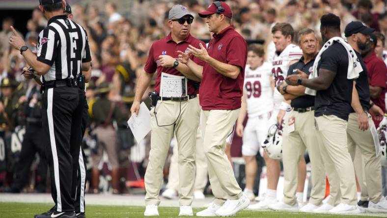 Oct 28, 2023; College Station, Texas, USA; South Carolina Gamecocks head coach Shane Beamer and assistant coach Pete Lembo work the sideline during the second quarter in a game against Texas A&M Aggies at Kyle Field. Mandatory Credit: Dustin Safranek-USA TODAY Sports