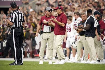 Oct 28, 2023; College Station, Texas, USA; South Carolina Gamecocks head coach Shane Beamer and assistant coach Pete Lembo work the sideline during the second quarter in a game against Texas A&M Aggies at Kyle Field. Mandatory Credit: Dustin Safranek-USA TODAY Sports