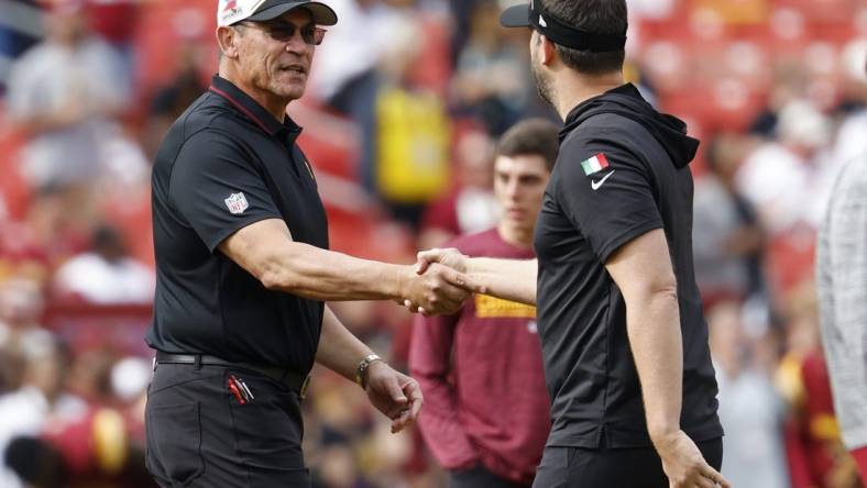 Oct 29, 2023; Landover, Maryland, USA; Washington Commanders head coach Ron Rivera (L) shakes hands with Philadelphia Eagles head coach Nick Sirianni (R) during warmup prior to their game at FedExField. Mandatory Credit: Geoff Burke-USA TODAY Sports