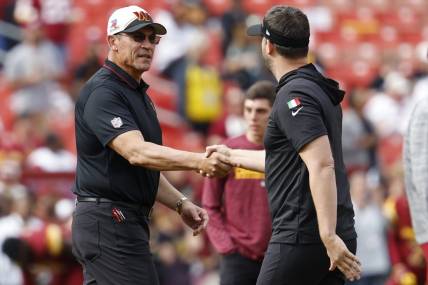 Oct 29, 2023; Landover, Maryland, USA; Washington Commanders head coach Ron Rivera (L) shakes hands with Philadelphia Eagles head coach Nick Sirianni (R) during warmup prior to their game at FedExField. Mandatory Credit: Geoff Burke-USA TODAY Sports