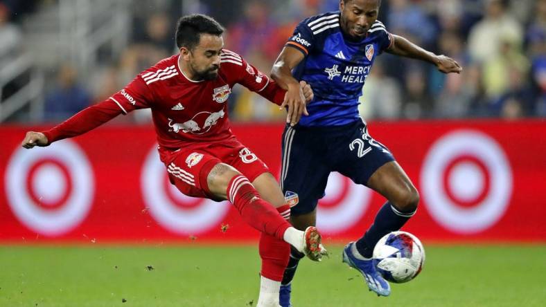 Oct 29, 2023; Cincinnati, OH, USA; New York Red Bulls midfielder Luquinhas (82) battles for the ball against FC Cincinnati defender Ray Gaddis (28) during the first half of game one in a round one match of the 2023 MLS Cup Playoffs at TQL Stadium. Mandatory Credit: Katie Stratman-USA TODAY Sports