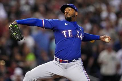Texas Rangers relief pitcher Aroldis Chapman (45) pitches during the seventh inning against the Arizona Diamondbacks during game five of the 2023 World Series at Chase Field.