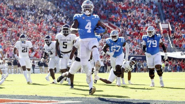 Nov 4, 2023; Oxford, Mississippi, USA; Mississippi Rebels running back Quinshon Judkins (4) runs the ball for a touchdown during the first half against the Texas A&M Aggies at Vaught-Hemingway Stadium. Mandatory Credit: Petre Thomas-USA TODAY Sports