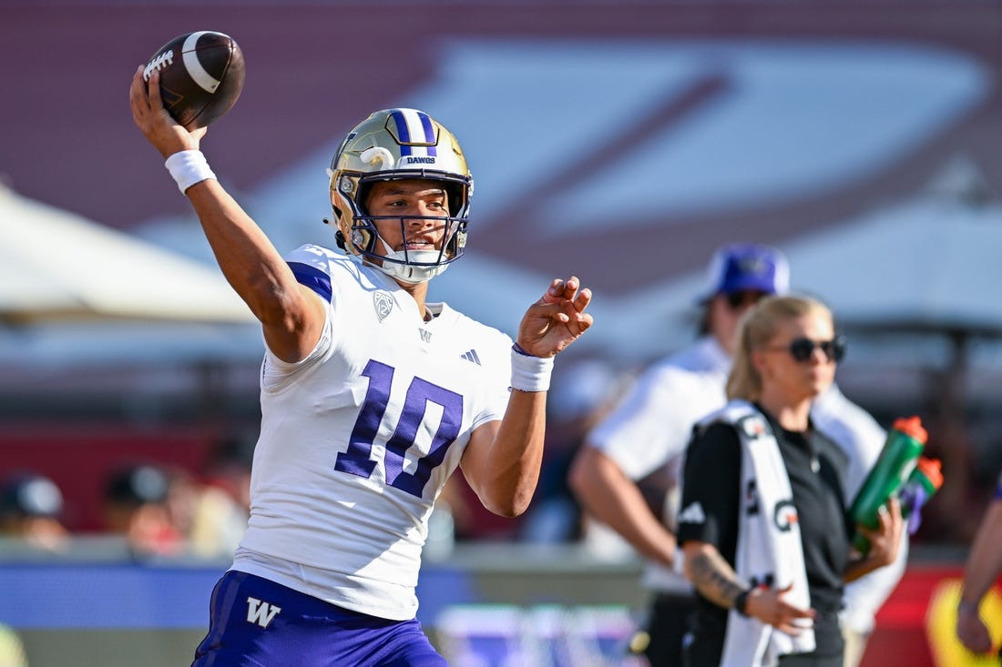 Nov 4, 2023; Los Angeles, California, USA; Washington Huskies quarterback Austin Mack (10) throws a pass against the USC Trojans during warmups at United Airlines Field at Los Angeles Memorial Coliseum. Mandatory Credit: Jonathan Hui-USA TODAY Sports