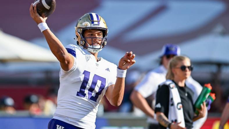 Nov 4, 2023; Los Angeles, California, USA; Washington Huskies quarterback Austin Mack (10) throws a pass against the USC Trojans during warmups at United Airlines Field at Los Angeles Memorial Coliseum. Mandatory Credit: Jonathan Hui-USA TODAY Sports