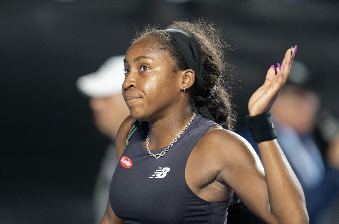 Nov 4, 2023; Cancun, Mexico; Coco Gauff (USA) waves as she leaves the court after her match against Jessica Pegula (USA) on day seven of the GNP Saguaros WTA Finals Cancun. Mandatory Credit: Susan Mullane-USA TODAY Sports