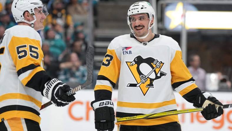 Nov 4, 2023; San Jose, California, USA; Pittsburgh Penguins left wing Matt Nieto (83) talks with center Noel Acciari (55) during the second period against the San Jose Sharks at SAP Center at San Jose. Mandatory Credit: Darren Yamashita-USA TODAY Sports