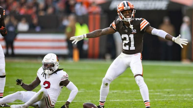 Nov 5, 2023; Cleveland, Ohio, USA; Cleveland Browns cornerback Denzel Ward (21) celebrates his broken up pass intended for Arizona Cardinals wide receiver Marquise Brown (2) during the third quarter at Cleveland Browns Stadium. Mandatory Credit: Scott Galvin-USA TODAY Sports