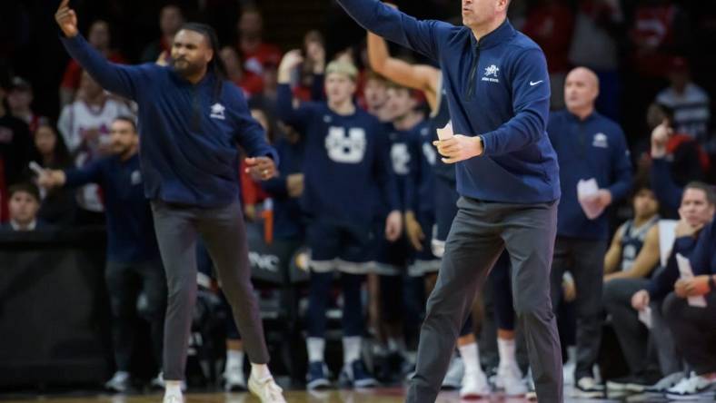 Utah State head coach Danny Sprinkle, right, and his assistants shout instructions to the Aggies in the final seconds of the second half of the Bradley Braves' home opener Saturday, Nov. 11, 2023 at Carver Arena.