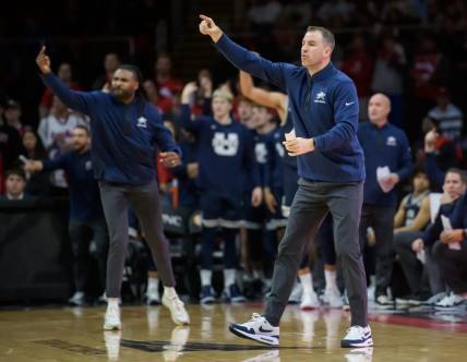 Utah State head coach Danny Sprinkle, right, and his assistants shout instructions to the Aggies in the final seconds of the second half of the Bradley Braves' home opener Saturday, Nov. 11, 2023 at Carver Arena.