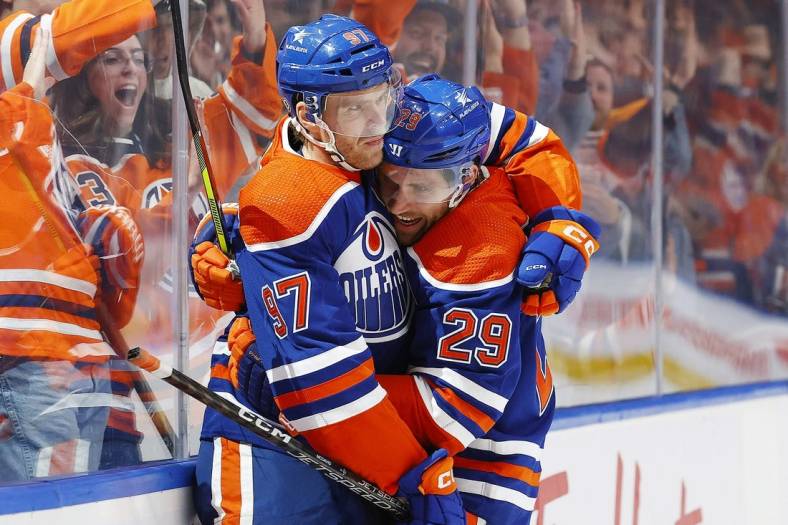 Nov 13, 2023; Edmonton, Alberta, CAN; Edmonton Oilers forward Connor McDavid (97) celebrates his goal with center Leon Draisaitl (29) during the third period against the New York Islanders at Rogers Place. Mandatory Credit: Perry Nelson-USA TODAY Sports