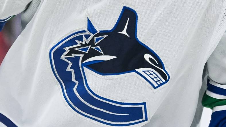 Nov 12, 2023; Montreal, Quebec, CAN; View of a Vancouver Canucks logo on a jersey worn by a member of the team against the Montreal Canadiens during the second period at Bell Centre. Mandatory Credit: David Kirouac-USA TODAY Sports