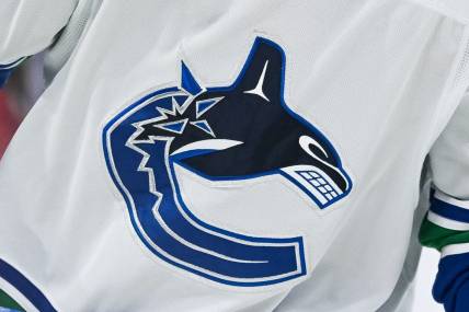 Nov 12, 2023; Montreal, Quebec, CAN; View of a Vancouver Canucks logo on a jersey worn by a member of the team against the Montreal Canadiens during the second period at Bell Centre. Mandatory Credit: David Kirouac-USA TODAY Sports