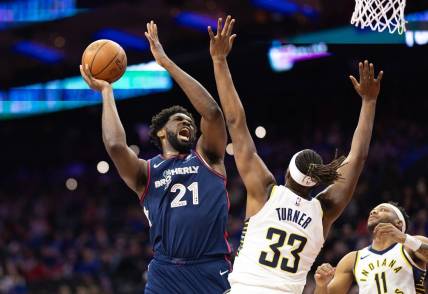 Nov 14, 2023; Philadelphia, Pennsylvania, USA; Philadelphia 76ers center Joel Embiid (21) drives for a shot against Indiana Pacers center Myles Turner (33) during the first quarter at Wells Fargo Center. Mandatory Credit: Bill Streicher-USA TODAY Sports