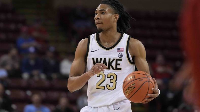 Nov 16, 2023; Charleston, South Carolina, USA; Wake Forest Demon Deacons guard Hunter Sallis (23) brings the ball up court in the first half against the Utah Utes at TD Arena. Mandatory Credit: David Yeazell-USA TODAY Sports