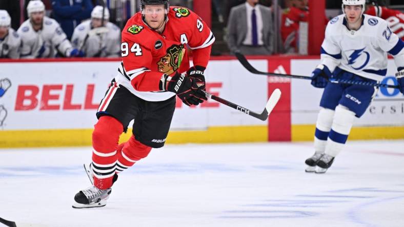 Nov 16, 2023; Chicago, Illinois, USA; Chicago Blackhawks forward Corey Perry (94) chases after a loose puck in the third period against the Tampa Bay Lightning at United Center. Mandatory Credit: Jamie Sabau-USA TODAY Sports