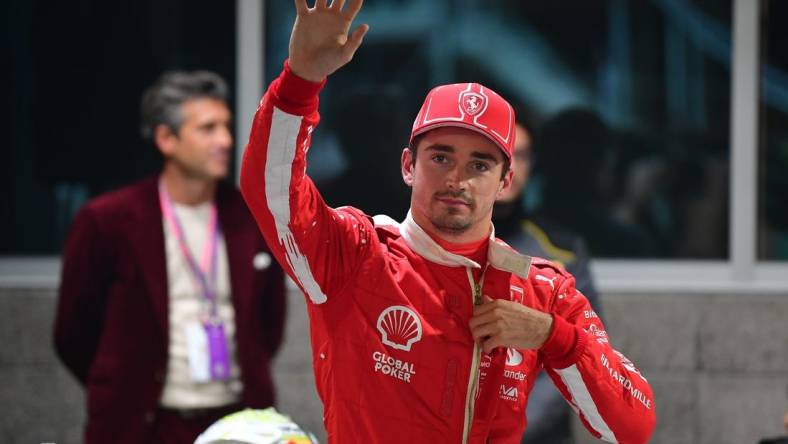 Nov 17, 2023; Las Vegas, Nevada, USA; Scuderia Ferrari driver Charles LeClerc of Monaco (16) celebrates after securing pole position during qualifying at Las Vegas Strip Circuit. Mandatory Credit: Gary A. Vasquez-USA TODAY Sports