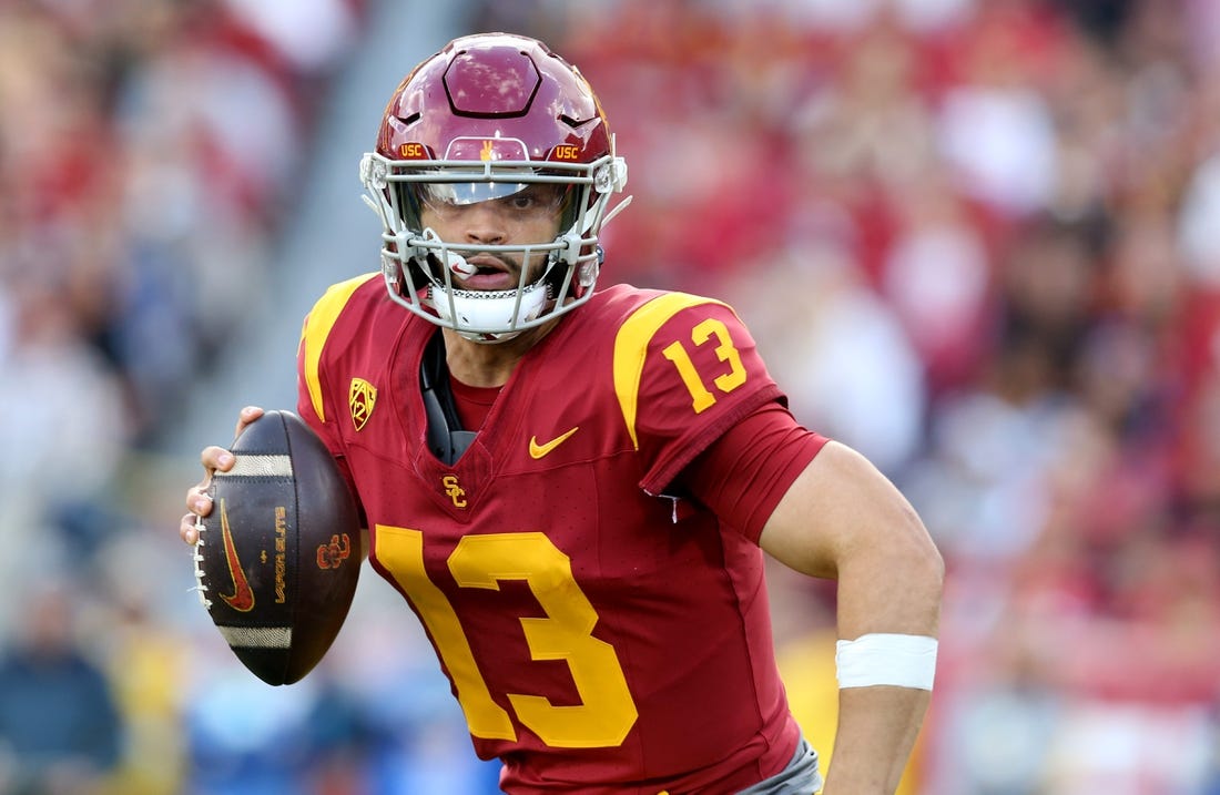 Nov 18, 2023; Los Angeles, California, USA; USC Trojans quarterback Caleb Williams (13) scrambles during the second quarter against the UCLA Bruins at United Airlines Field at Los Angeles Memorial Coliseum. Mandatory Credit: Jason Parkhurst-USA TODAY Sports