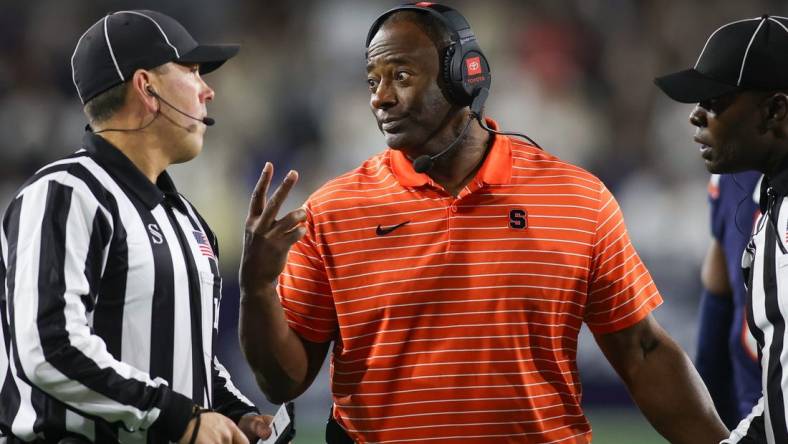 Nov 18, 2023; Atlanta, Georgia, USA; Syracuse Orange head coach Dino Babers talks to a referee against the Georgia Tech Yellow Jackets in the first half at Bobby Dodd Stadium at Hyundai Field. Mandatory Credit: Brett Davis-USA TODAY Sports