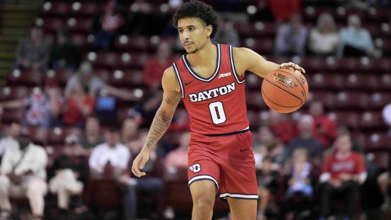 Nov 19, 2023; Charleston, SC, USA; Dayton Flyers guard Javon Bennett (0) brings the ball up court in the second half against the Houston Cougars at TD Arena. Mandatory Credit: David Yeazell-USA TODAY Sports