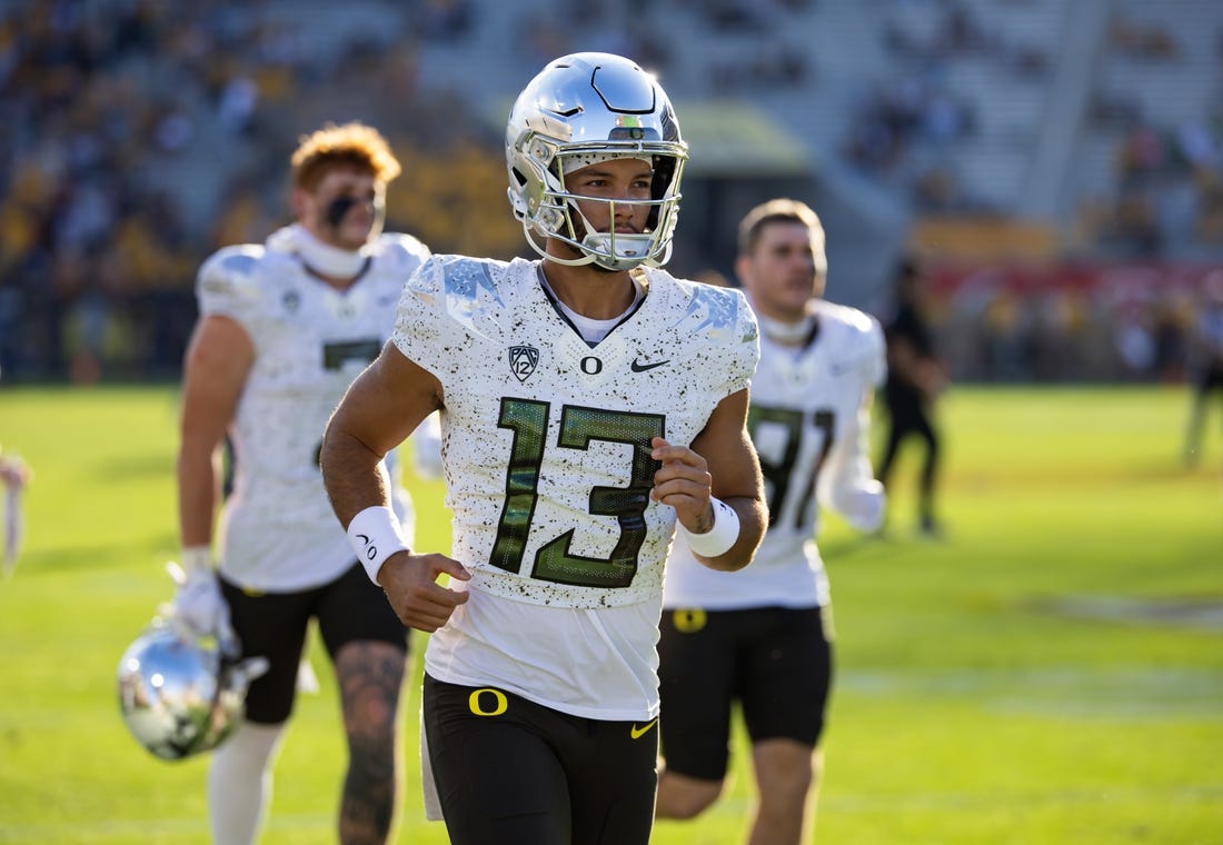 Nov 18, 2023; Tempe, Arizona, USA; Oregon Ducks quarterback Ty Thompson (13) against the Arizona State Sun Devils at Mountain America Stadium. Mandatory Credit: Mark J. Rebilas-USA TODAY Sports