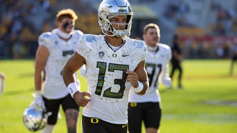 Nov 18, 2023; Tempe, Arizona, USA; Oregon Ducks quarterback Ty Thompson (13) against the Arizona State Sun Devils at Mountain America Stadium. Mandatory Credit: Mark J. Rebilas-USA TODAY Sports