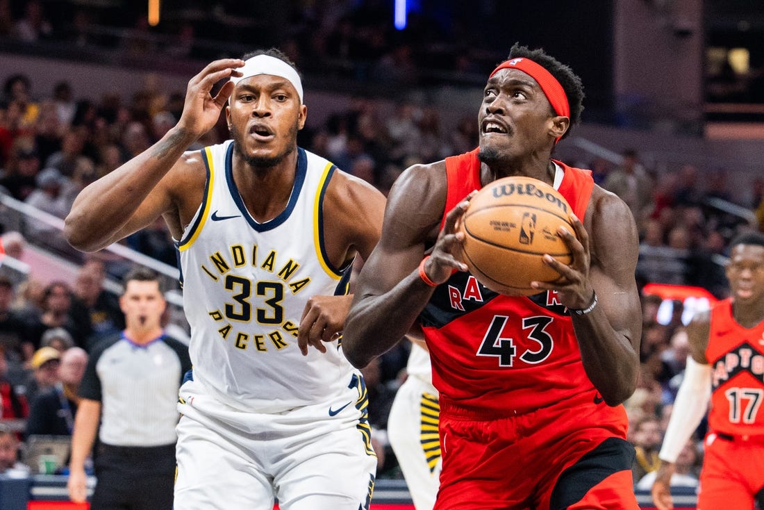 Nov 22, 2023; Indianapolis, Indiana, USA; Toronto Raptors forward Pascal Siakam (43) shoots the ball while Indiana Pacers center Myles Turner (33) defends in the first quarter at Gainbridge Fieldhouse. Mandatory Credit: Trevor Ruszkowski-USA TODAY Sports